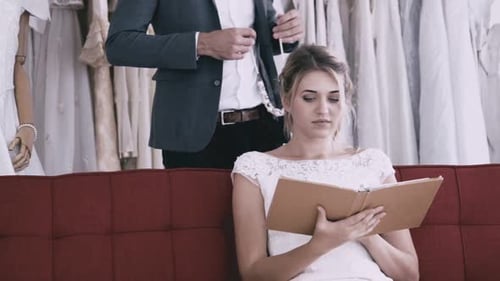 Playful Couple Shopping For Wedding Attire Together