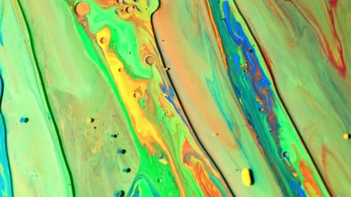 Colorful Sparkling Green Paints Mix. Oil Ink of Blue, Green, Yellow and Other Colors Spread on the