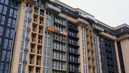 Building of new tower architecture. Modern multi storey building under construction.