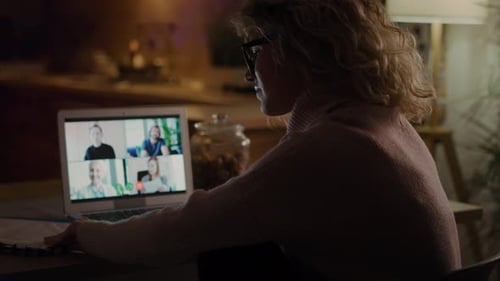 Woman in Home Video Conference with Four Participants