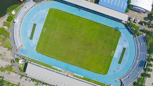 Aerial top view of soccer football sport recreation field ground, national stadium. Urban city town