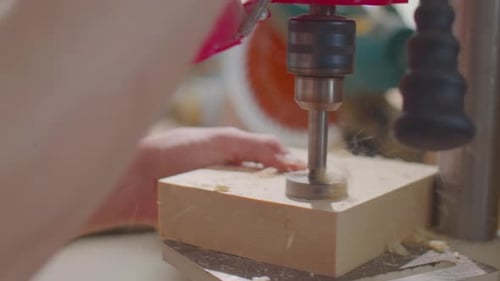 Woodworker Drilling Hole With Drill Press, Close-up