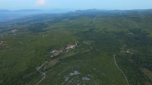 Aerial view of remote village in green peaceful valley