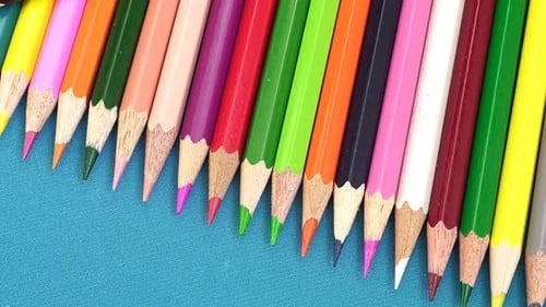 Row of Colorful Pencils with a Black Pencil