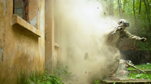 Military men falling after explosion, slow motion