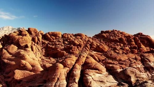Climbing drone footage of red sandstone mountains at Red Rock Canyon Park near Las Vegas