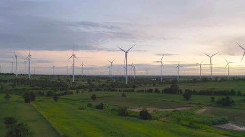 Aerial view of wind turbines or windmills farm field in industry factory. Power, sustainable green