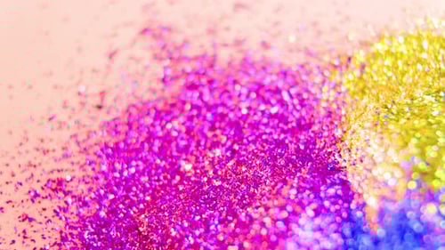 Sparkling Glitter Powder on a Pink Surface