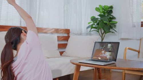 Woman Doing Online Yoga at Home