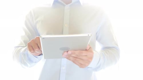 Close Up of Man Using Tablet