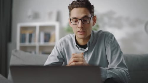 Man Talking During Video Conference on Laptop