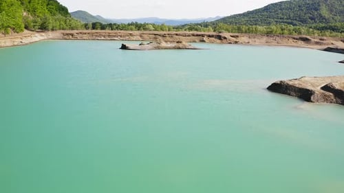 Drone View of the Turquoise Lake Formed As a Result of Mining Waste