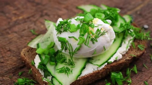 Delicious Open Sandwich with Cucumber and Poached Egg