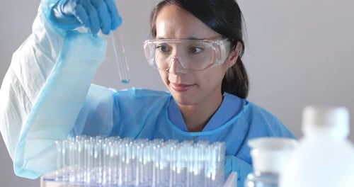 Scientist Examining Test Tube in a Lab