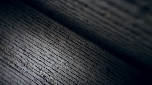 Dynamic Light Moving Across a Textured Stone Wall Background