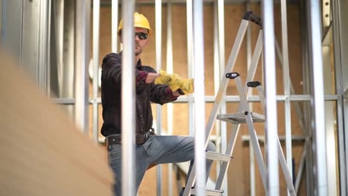 Construction Worker and Steel Frame