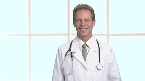 Smiling Doctor in White Coat and Tie