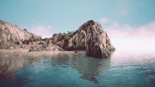 Felsige tropische Insel im Ozean