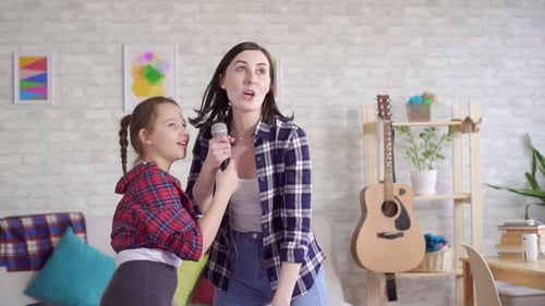 Close Up Mom and Daughter Emotionally Sing Karaoke at Home Slow Mo