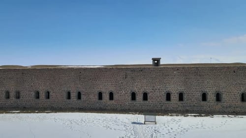 Stone Fortress on Snowy Landscape Aerial Shot