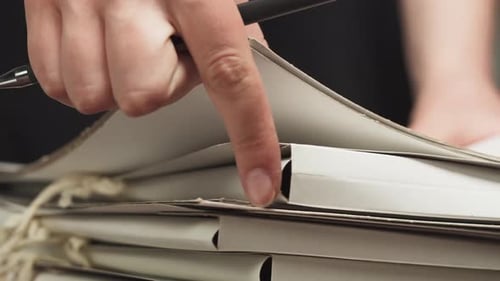 Raising and Sorting Through Folders with Hands Counting Files Searching for the Right Documents