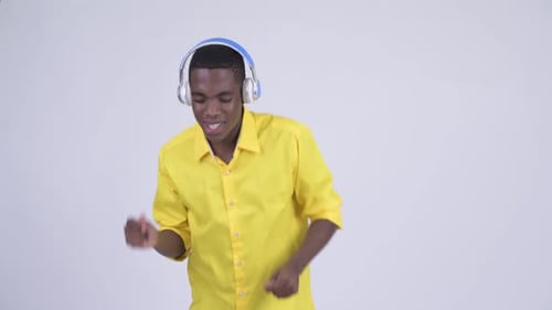 Man Dancing With Headphones on in a Bright Shirt