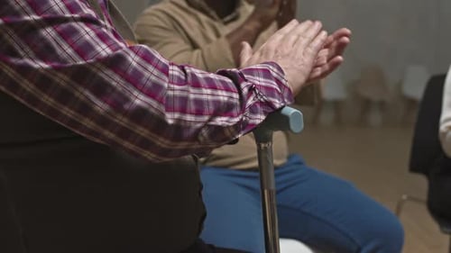 Adults Clapping Hands During Support Group Meeting