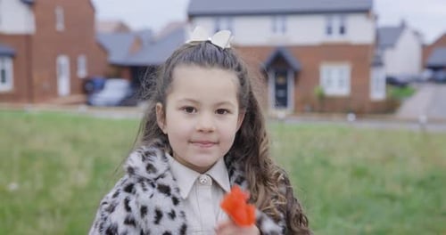 Authentic mixed race smiling girl portrait at park