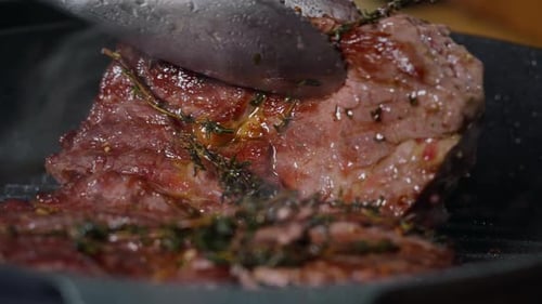 Steak Being Pressed in Pan Close Up