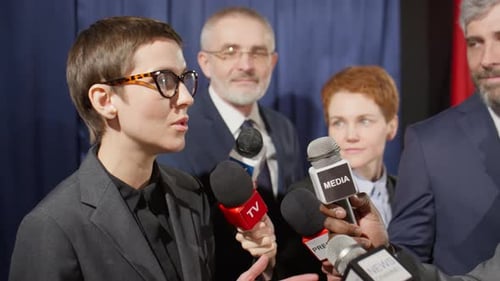 Politician Answering Questions at a Press Conference