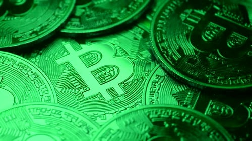 Macro View of Bitcoins Lit With Green Light