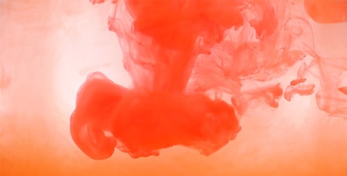 Red Orange Paint Dissolved In Water