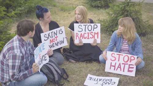 Sit-in Protest of Caucasian People Against Human Rights Violation. Male and Female Activists with