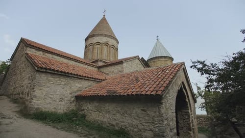 Old Orthodox Church of Stone and Brick with Tiled Roof and High Towers, Highlands of Georgia