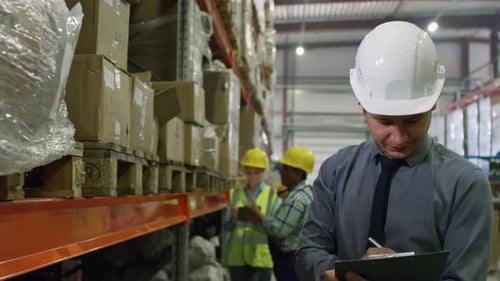 Warehouse Manager Working in Factory