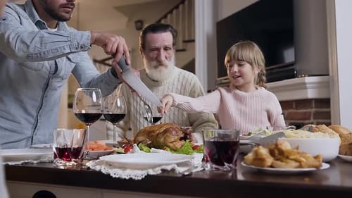 Family Celebrates Thanksgiving Dinner Together at Home