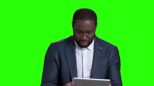 Adult Man Using Tablet on Green Screen