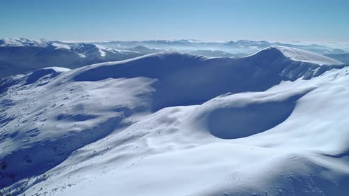 Majestic Snow-Covered Mountains Aerial View in Winter