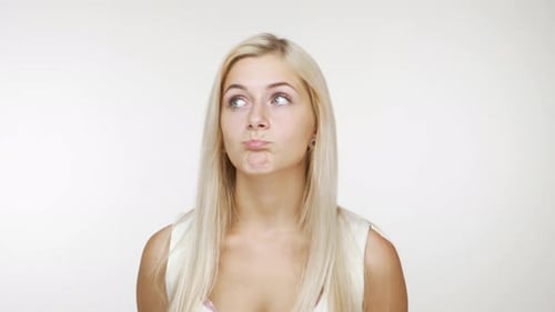 Young Blond Woman Glancing with a Smile