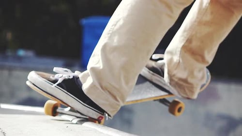 Close Up of Skateboard Trick at Skate Park