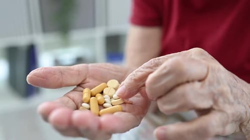 Senior Adult Counting Prescription Medication Pills