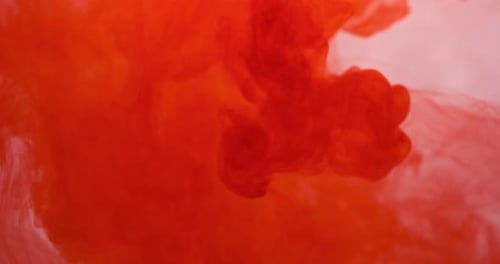 Red Ink Dissolving in Clear Liquid, Abstract