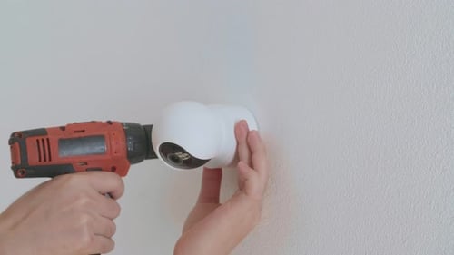Installing Security Camera on the Wall with Drill