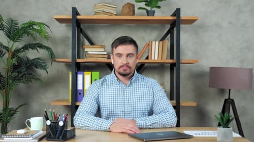 Man In Office Talking on Video Call