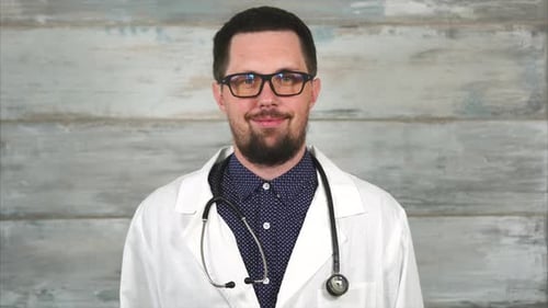 Bearded Man Doctor in Glasses with Stethoscope