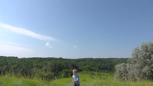 Boy Running Up the Hill