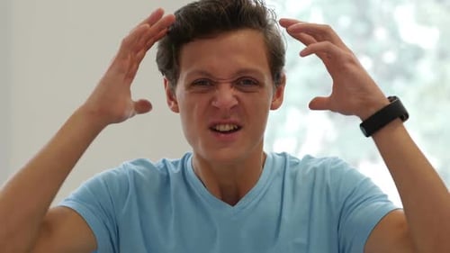 Frustrated Man Expressing Intense Emotions