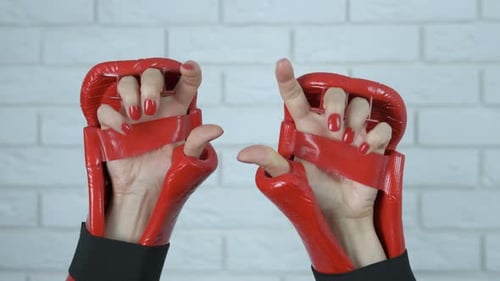 Close Up of Hands with Red Sports Gloves