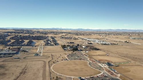 Aerial View of Suburban Neighborhood with Mountains