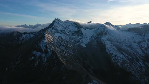 Evening Aerial View Of Snowed Alps Summits